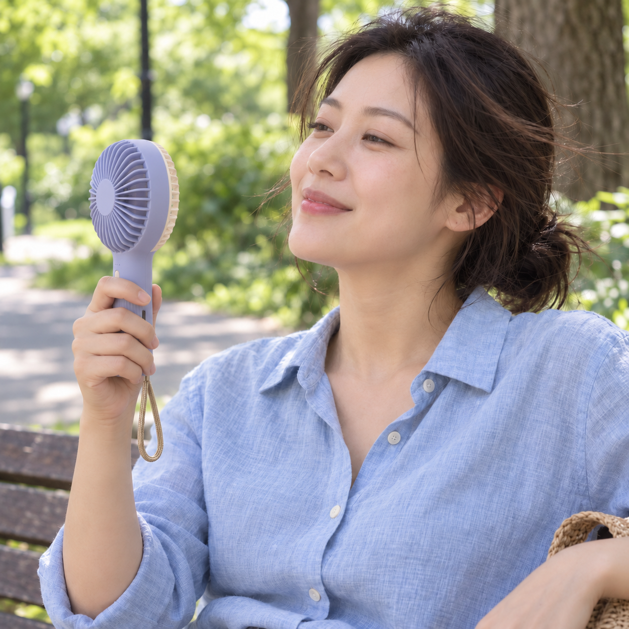 Rechargeable Handheld Fan in use